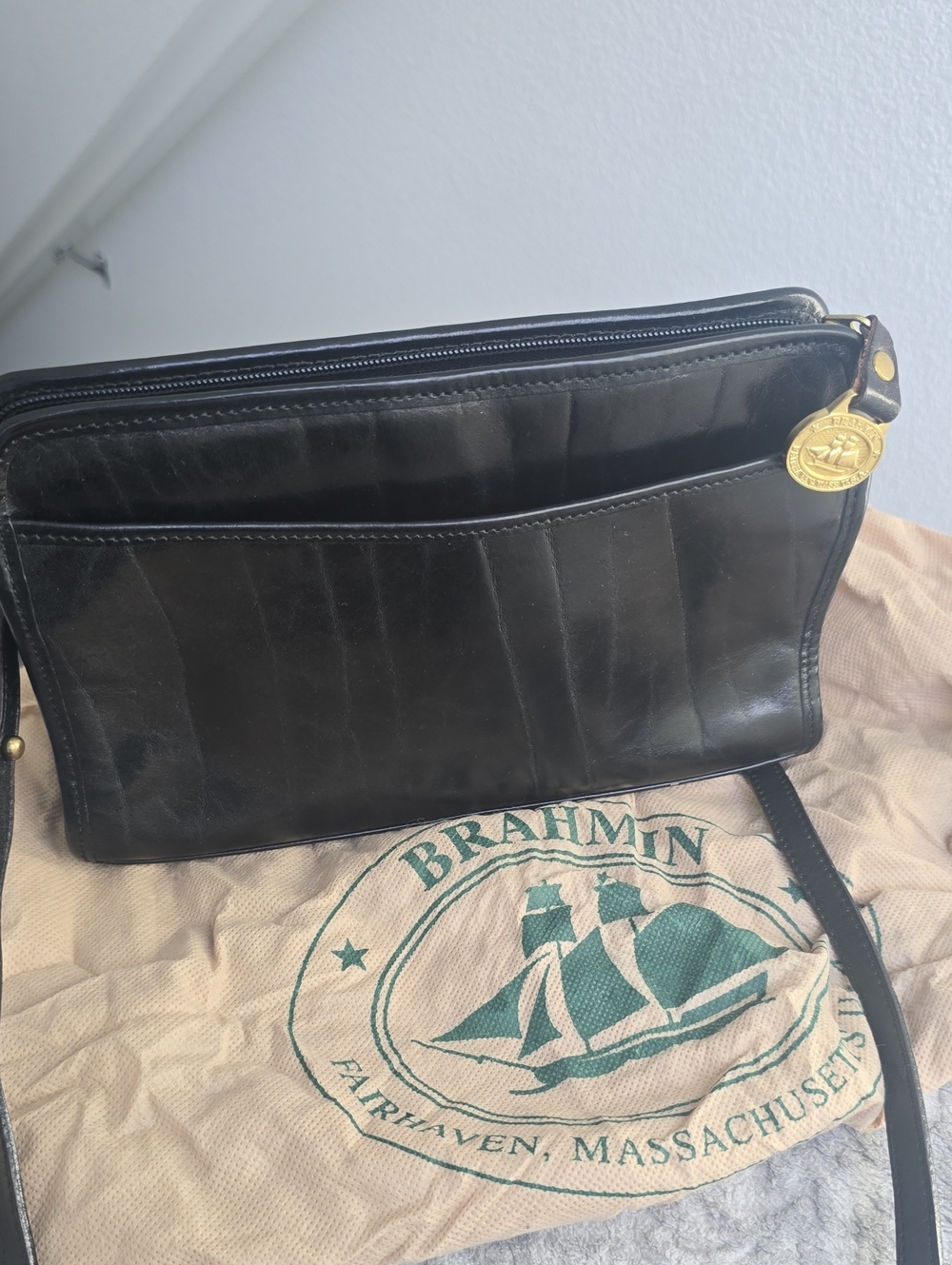 Brahmin Black Leather Messenger with Gold Medallion